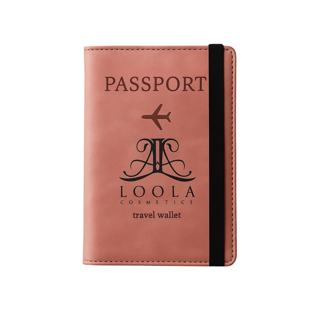 Pink passport holder with black text and Loola Cosmetics logo on a white background